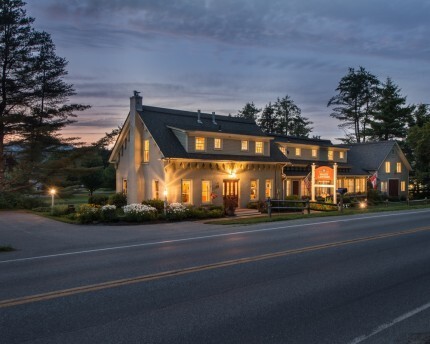 brass lantern inn lit up at night