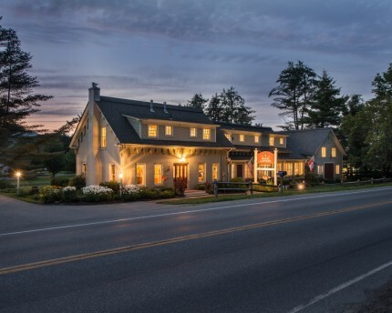 brass lantern inn lit up at night