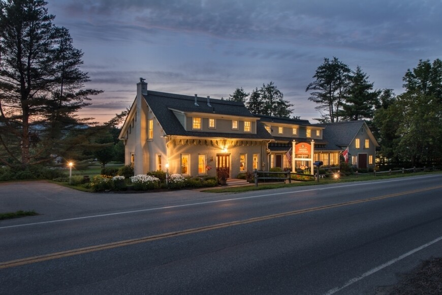 brass lantern inn lit up at night