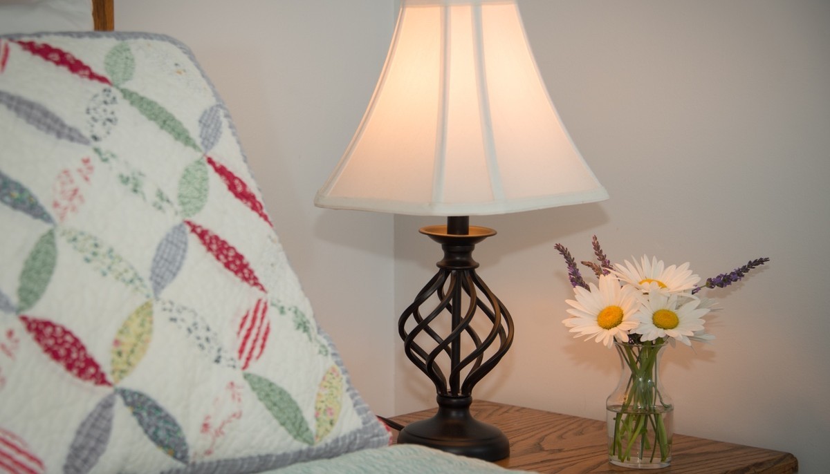 bedside table lamp and flowers