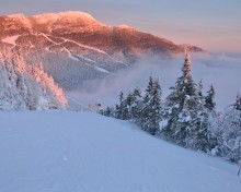 stowe sunrise over mount mansfield in winter